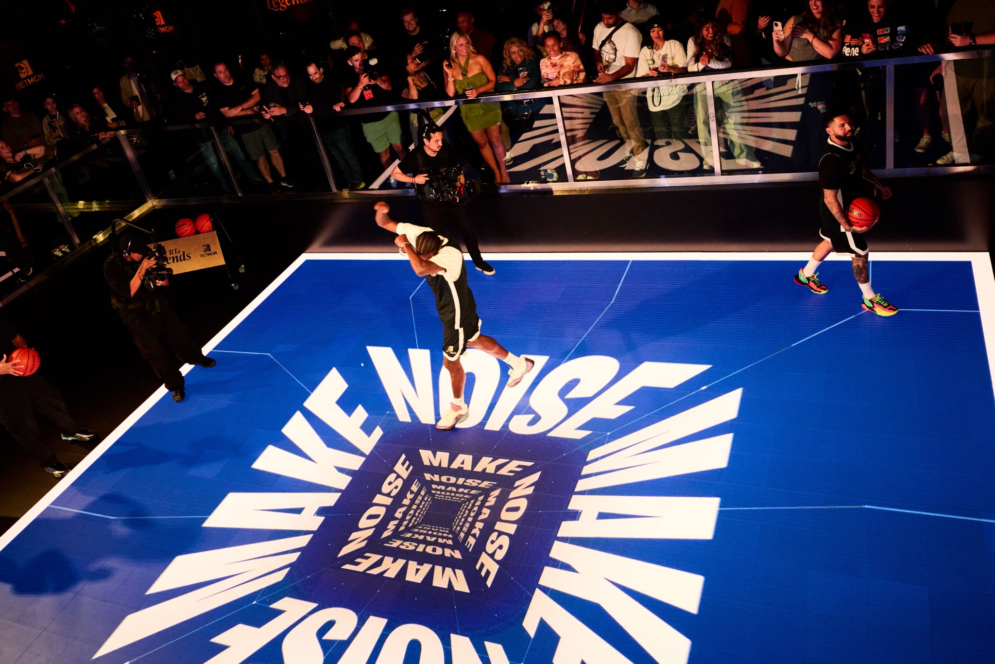 Players on BetMGM court with scoreboard
