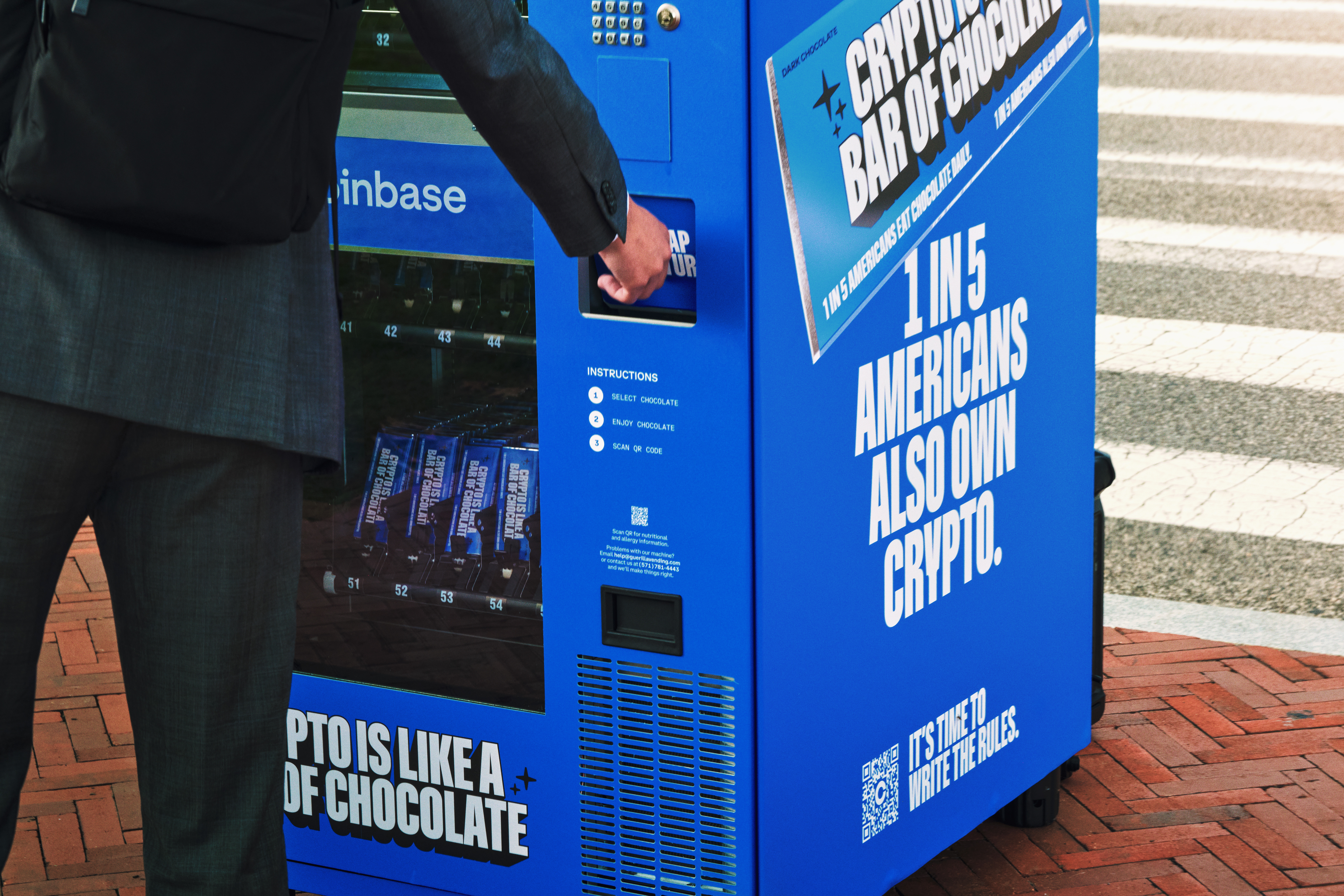 Person interacting with Coinbase vending machine