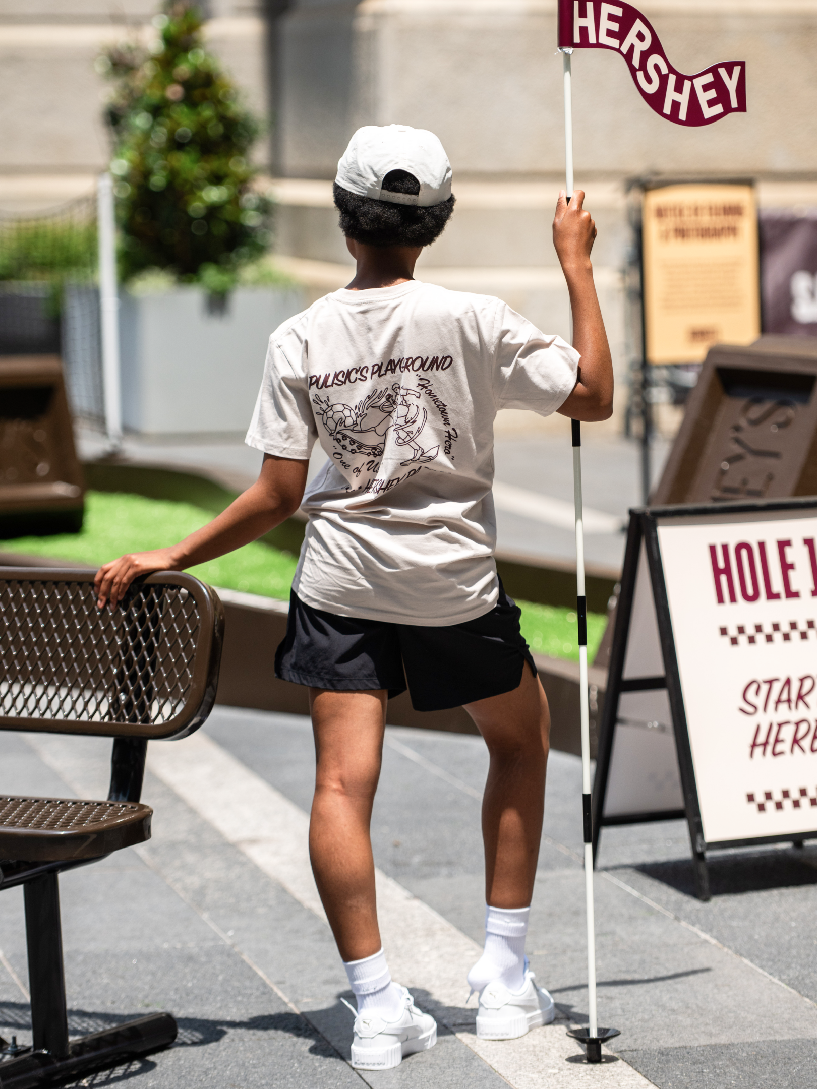 Fan holding the Hershey flag at Hole 1